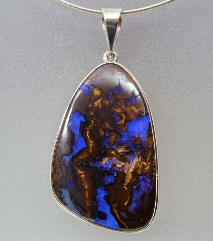 Boulder opal pendant in silver  - Boulder opal pendant set in silver 40 x 25mm.
