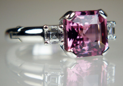 Asscher cut pink spinel & diamond ring in 14ct white gold - 4.07ct Asscher cut natural pink spinel flanked by a 0.51ct pair of Asscher cut diamonds in G colour VS clarity, mounted in a 14ct and 18ct white gold ring with Fingermate opening shank.