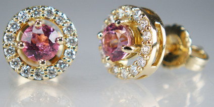 Pink tourmaline & diamond earstuds in 18ct yellow gold - 0.77ct pair of sparkling pink tourmalines set with a halo of 0.31ct diamonds in F/G colour SI clarity, mounted as earstuds in 18ct yellow gold