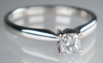 Half carat princess cut diamond ring in 18ct white gold - D colour VS1 clarity certified natural diamond, princess cut, mounted in simple 18ct white gold solitaire ring. This item is pre-loved, it has been checked by our gemmologist, the ring has been repolished and refinished and is in excellent condition. It represents superb value for money.
