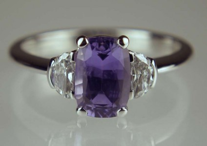 Lilac sapphire & diamond ring - 1.54ct rectangular cushion cut lilac sapphire set with 0.25ct half moon diamond pair in GH colour SI clarity, mounted in 18ct white gold