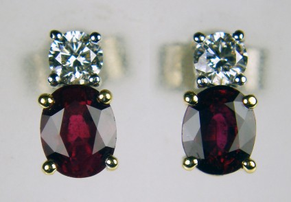 Ruby & diamond stud earrings - 0.92ct oval ruby pair set with 0.20ct of G/VS quality diamond rounds in 18ct yellow & white gold