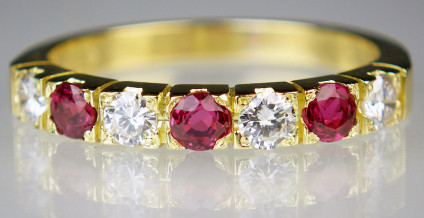 Ruby & diamond ring in 9ct yellow gold - 0.45ct of round cut rubies set with 0.40ct of diamonds in 9ct yellow gold. This pre-loved ring has been carefully inspected by our gemmologist and goldsmith and comes with a six month Just Gems warranty.