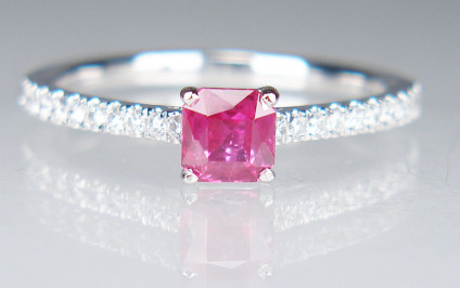 Ruby & diamond ring in platinum - 0.54ct top colour natural ruby 4.2mm square Asscher cut set with 0.16ct of round brilliant cut diamonds in platinum. Ring size is M. This ring can be sized up a maximum of two sizes.