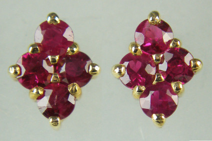 Ruby cluster earstuds in 9ct yellow gold - 0.75ct of ruby rounds set as cluster earstuds in 9ct yellow gold. Earstuds are 8.3x6.5mm.