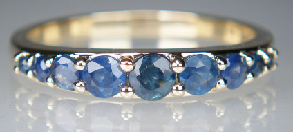 nine stone sapphire ring in 9ct yellow gold - Pretty, delicate sapphire ring set with nine round cut sapphires in 9ct yellow gold. Ring size O, can be supplied in other sizes.
