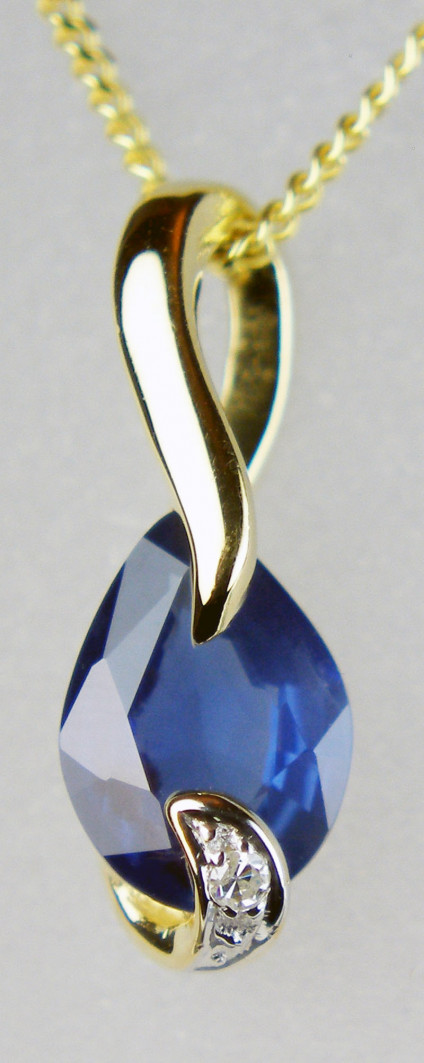 Sapphire & diamond pendant in 9ct yellow gold - 0.77ct oval sapphire set with 1 point round brilliant cut diamond in 9ct yellow gold and suspended from an 18" 9ct yellow gold chain. This dainty pendant is 13mm long