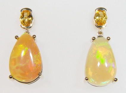 Yellow sapphire & Ethiopian Opal ear drops in 9ct yellow gold - 8.4ct pear cabochon pair of golden coloured Ethiopian opals set below a 0.92ct matched pair of pretty oval natural yellow sapphires, set in 9ct yellow gold. A truly delightful pair of beautiful earrings. Ethiopian Opal is always excellent value for money.