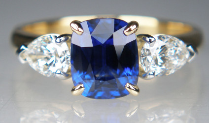 Sapphire & diamond ring - 1.64ct cushion cut natural blue sapphire, from Madagascar, set with a 0.62ct pair of pear cut diamonds in F colour VS clarity, all 3 stones are claw set. The diamonds are set in platinum.