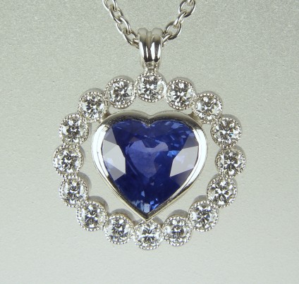 Sapphire heart pendant - 1.34ct heart cut sapphire set with 0.3ct round brilliant cut diamonds in 18ct white gold