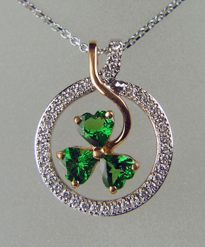 Shamrock pendant in rose gold - Exquisite pendant set with 1.27ct of heart cut green tsavorite garnets and 0.26ct of F colour VS clarity round brilliant cut diamonds, mounted in 18ct rose and white gold and suspended from a 16" 18ct white gold chain