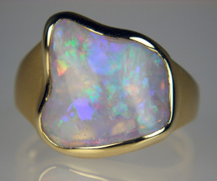 Australian crystal shell opal set in 18ct yellow gold ring - 2.22ct polished domed crystal opal from Coober Pedy, Australia, the replaced shell of an ancient bivalve, mounted in 18ct yellow gold brushed and polished gold ring