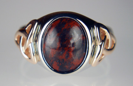 Man's signet ring with Scottish jasper, in palladium and Irish rose gold - Another bespoke creation from Just Gems, a melding of Scottish and Irish elements, with a St Cyrus jasper and hematite cabochon sourced by Adam MacIntosh, set in a stout palladium mount with Celtic knots on the shoulders made using Irish rose gold