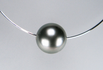 Finest quality Tahitian pearl - 14mm top quality Tahitian pearl carefully drilled and worn on a simple silver cable. Pearl is £290 (other colours and sizes available), silver cable is £35. We also sell cables in gold (yellow or white), steel and gold vermeil.