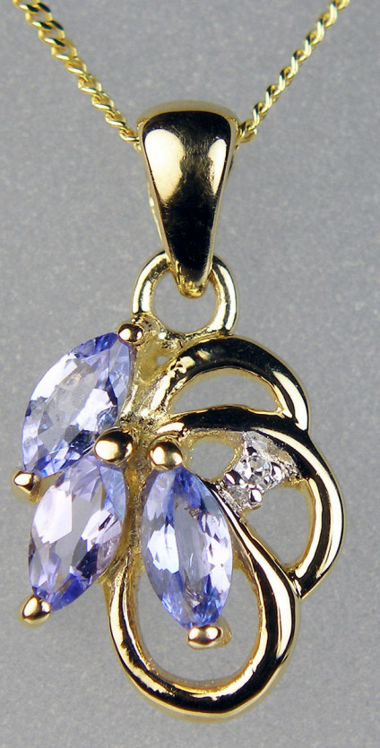 Tanzanite marquise cut pendant in 9ct yellow gold - Three marquise cut tanzanites totalling 0.30ct set with a half point diamond in 9ct yellow gold