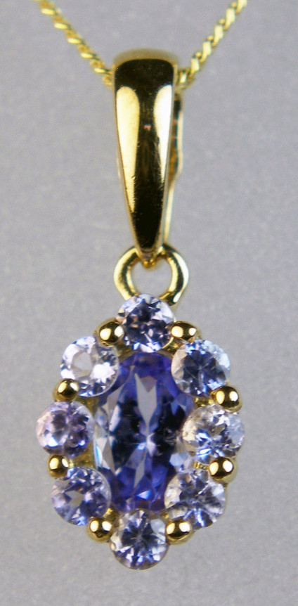 Tanzanite cluster pendant  - Cluster pendant set with tanzanites in 9ct yellow gold suspended from a 9ct 18" yellow gold chain