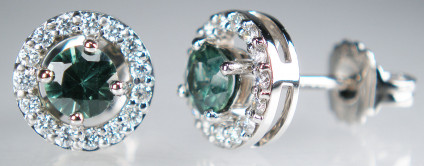 Teal sapphire & diamond earstuds in 18ct white gold - Beautiful and sparkly teal coloured natural sapphires weighing 0.87ct in a diamond halo surround of 0.31ct F/G colour SI clarity white diamonds, mounted in 18ct white gold earstuds