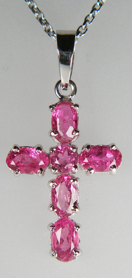 Bright pink tourmaline cross in 14ct white gold - Six bright pick tourmalines claw set in 14ct white gold cross which measures 28mm long and 12mm wide