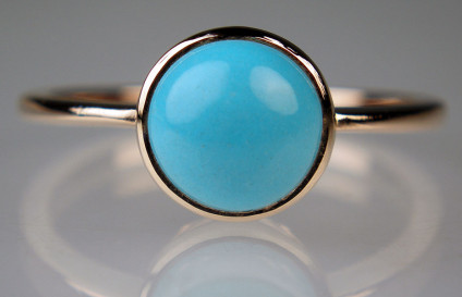Turquoise ring in 9ct rose gold - Round cabochon of top quality Iranian turquoise rubover set in 9ct rose gold