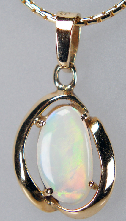 White opal pendant in 9ct yellow gold - Dainty white opal claw set in 9ct yellow gold pendant. Pendant measures 20x10mm. Chain not included in price.